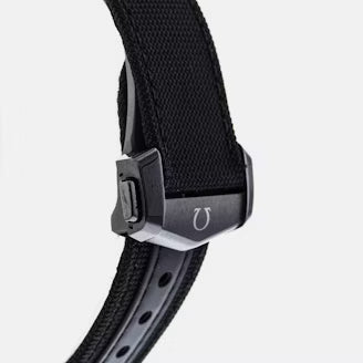 Close-up of a black watch strap with a buckle on a white background