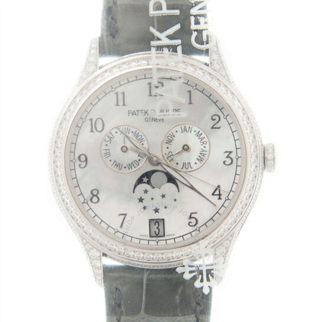 Watch with diamond-studded case and bezel on a white background