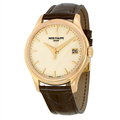 Patek Philippe watch with gold case and brown leather strap on a white background