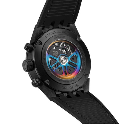 Black watch with a rainbow-colored mechanical component on a white background