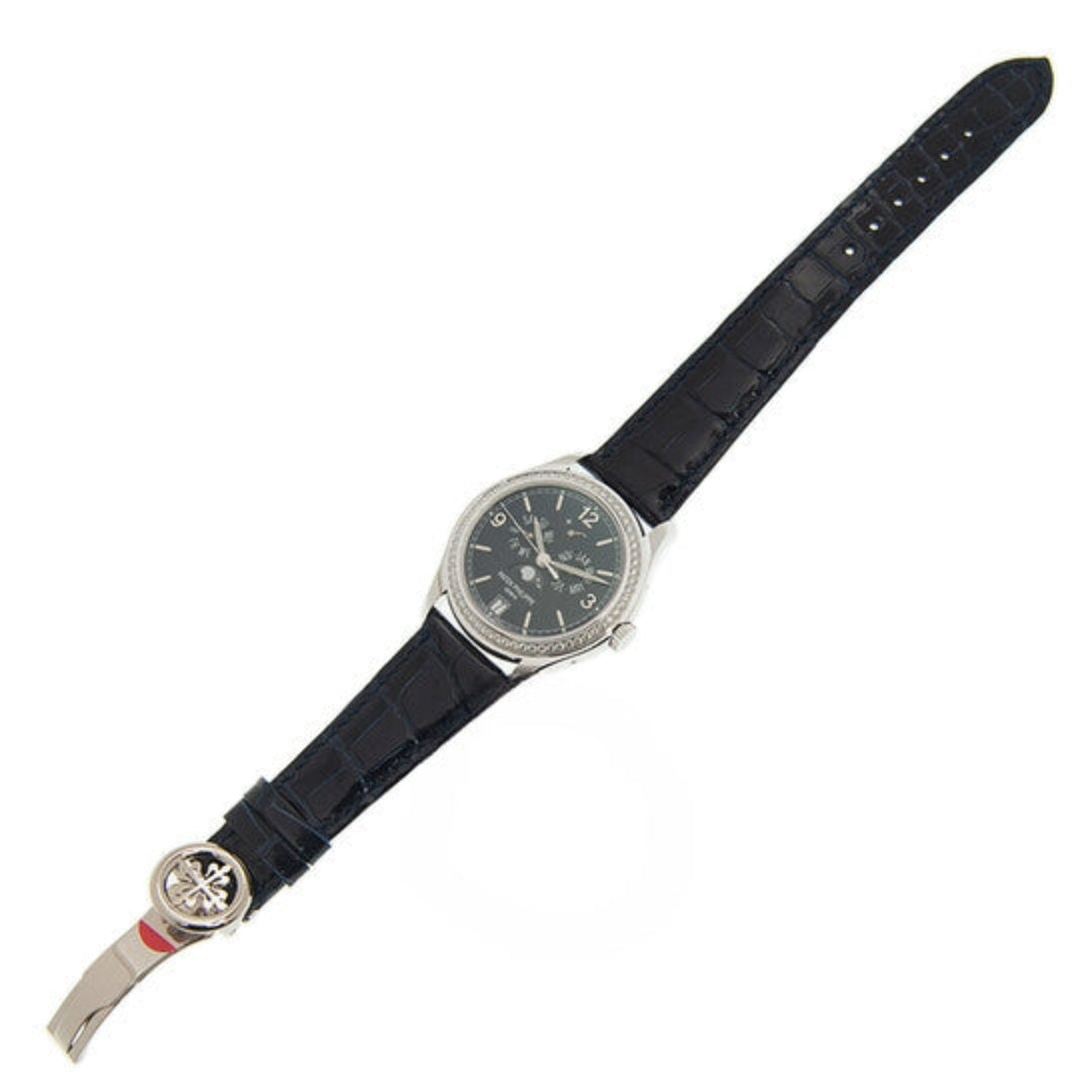 Wristwatch with black strap and silver case on a white background