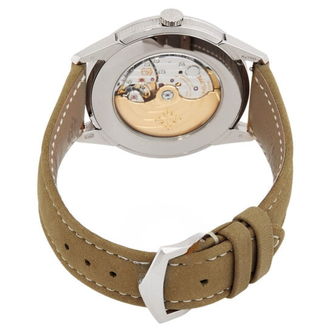 Watch with brown strap and visible mechanical components on a white background