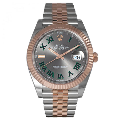 Rolex watch with silver and rose gold band on a white background