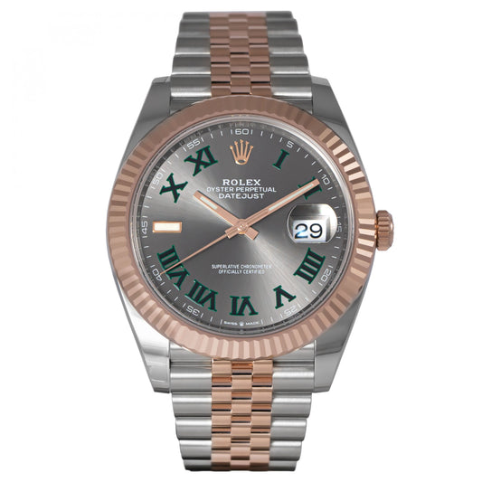 Rolex watch with silver and rose gold band on a white background