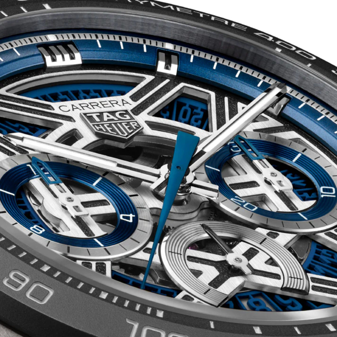 Close-up of a Tag Heuer Carrera watch with blue and silver details