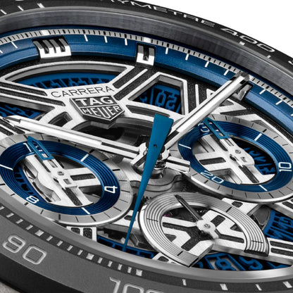 Close-up of a Tag Heuer Carrera watch with blue and silver details
