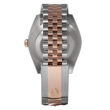 Close-up of a watch with a silver and rose gold band on a white background