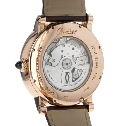 Cartier watch with rose gold case and leather strap on a white background