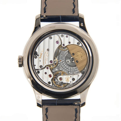 Watch with visible mechanical components on a white background