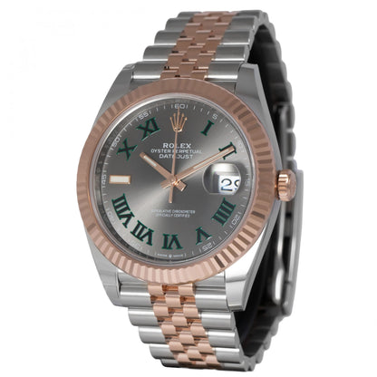 Rolex watch with silver and rose gold band on white background
