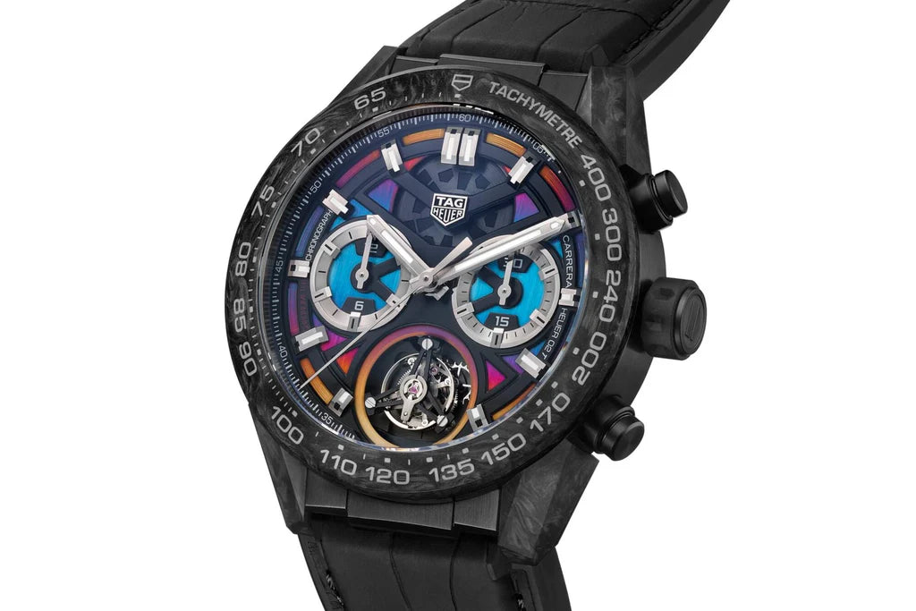 Luxury watch with a black strap and colorful face on a white background