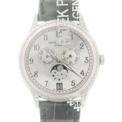 Watch with diamond-studded case and bezel on a white background
