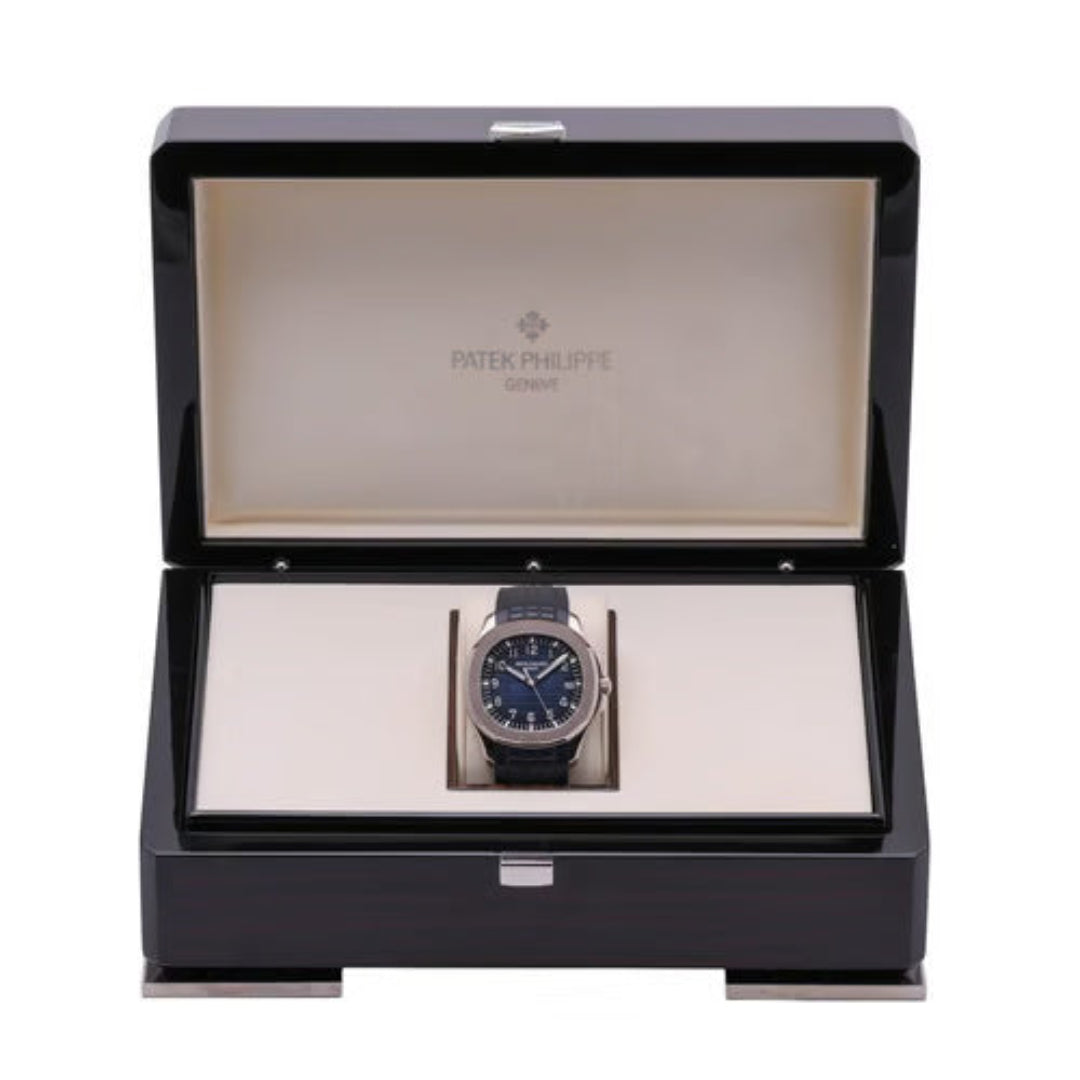 Patek Philippe watch in an open black display box on a white background
