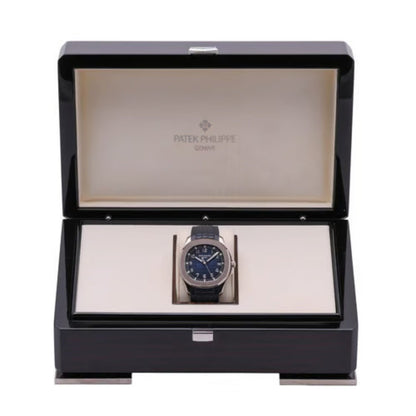 Patek Philippe watch in an open black display box on a white background