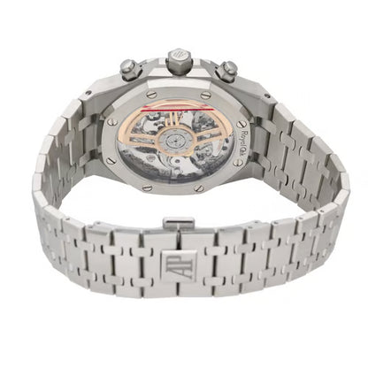 Silver watch with a detailed mechanical back on a white background