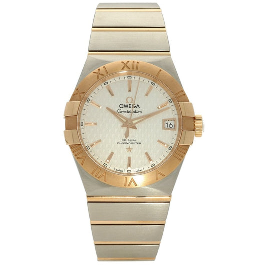 Gold and silver watch with Omega brand on a white background