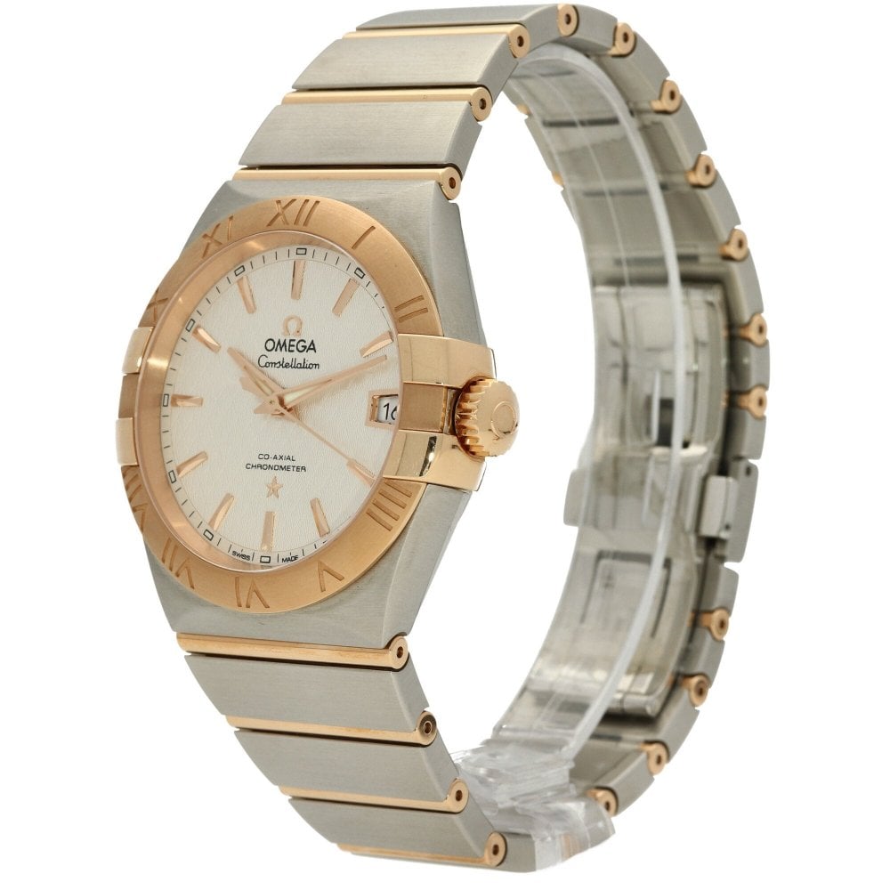 Luxury Omega watch with gold and silver band on white background