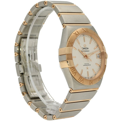 Luxury watch with silver and gold band on a white background