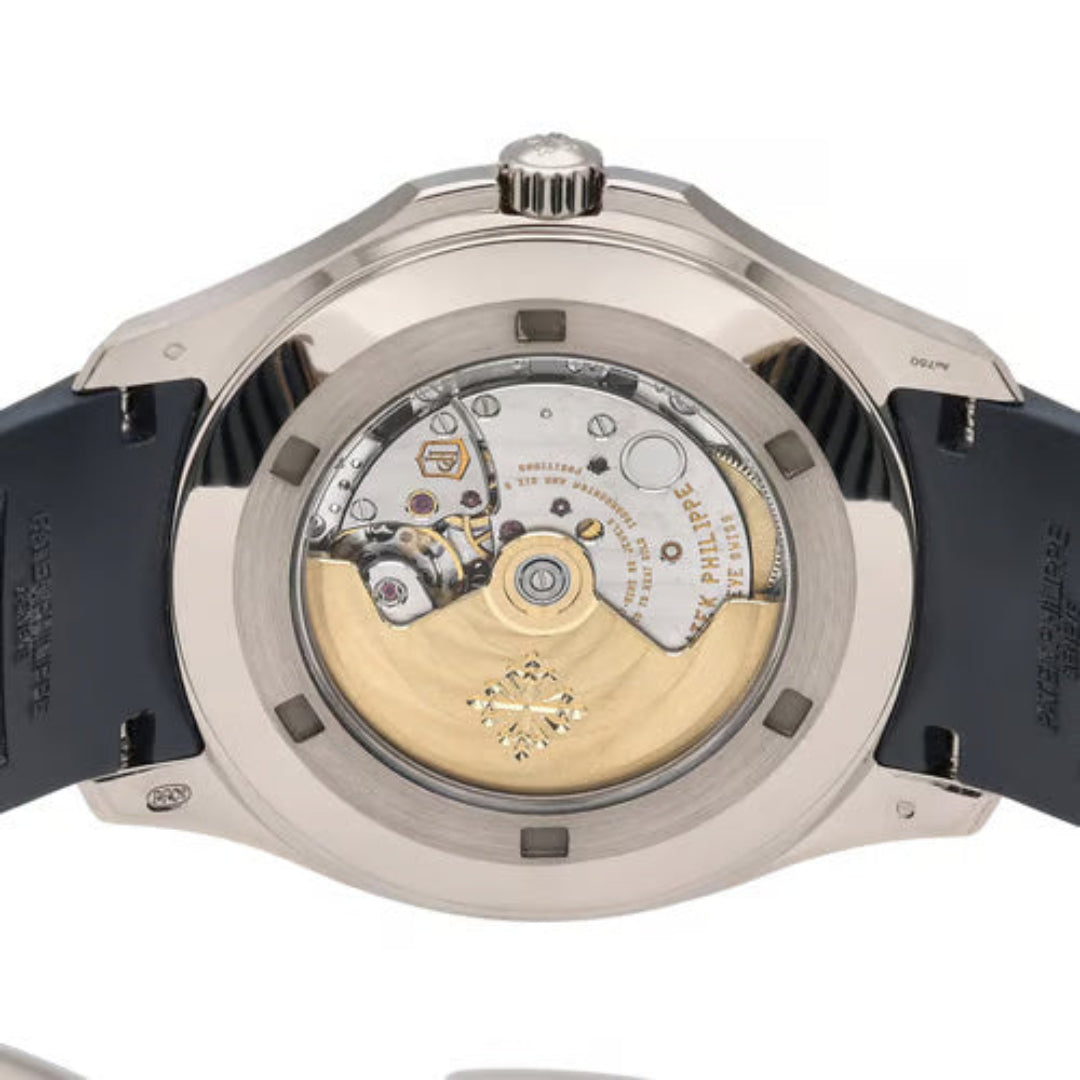 Close-up of a watch with visible mechanical components on a white background