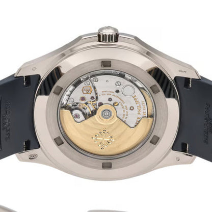 Close-up of a watch with visible mechanical components on a white background