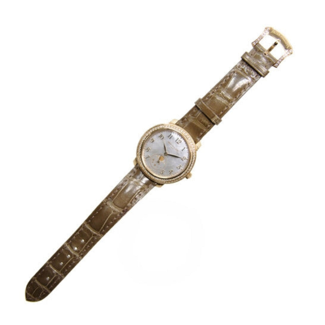 Watch with a brown strap on a white background
