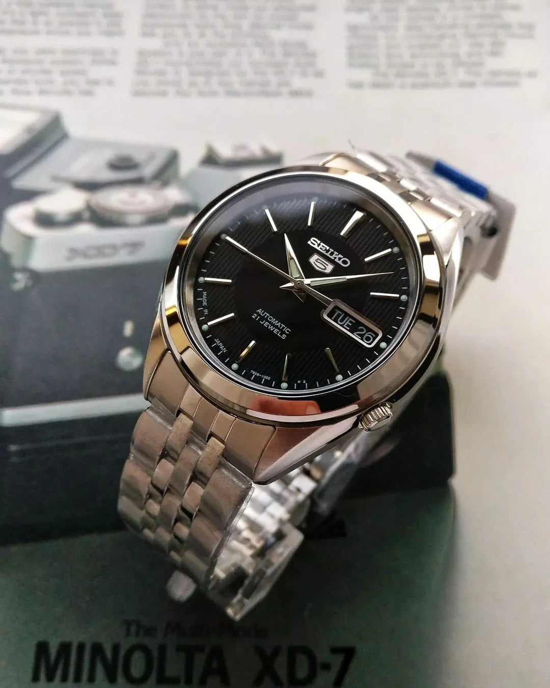 Seiko 5 SNKL23J1 – Men's Automatic Stainless Steel Watch with Black Dial, Day-Date Display & Transparent Case Back