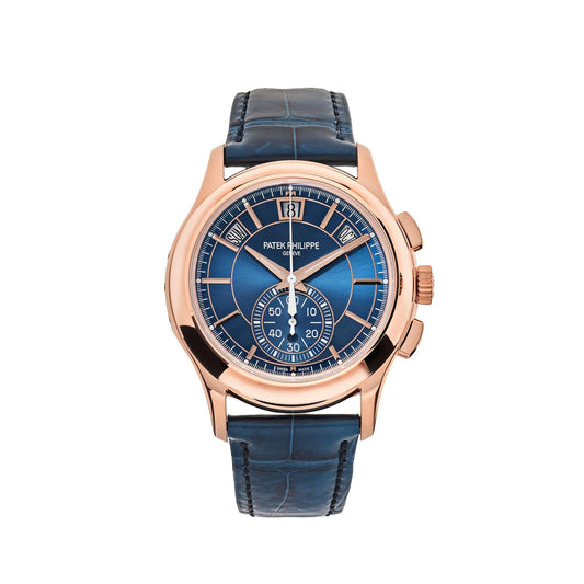 Luxury watch with blue face and rose gold case on a white background