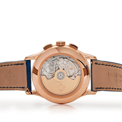 Rose gold watch with visible mechanical components on a white background
