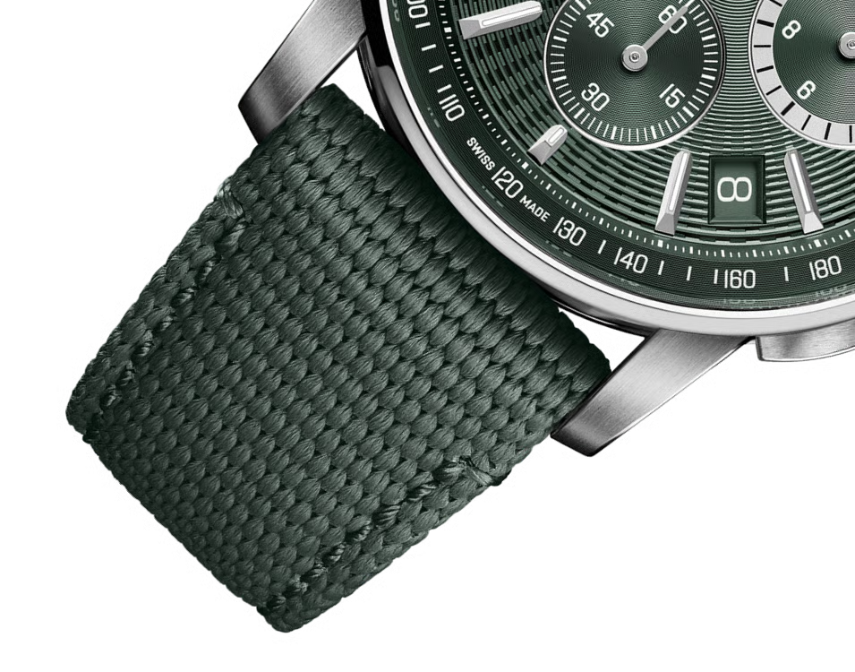 Watch with green strap and green dial on a white background