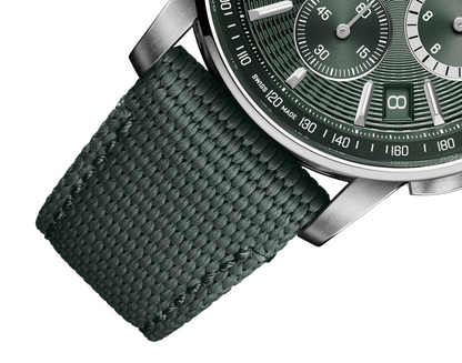 Watch with green strap and green dial on a white background