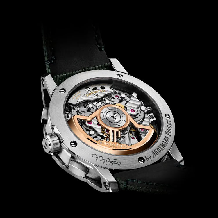 Watch back cover with mechanical movement on a black background