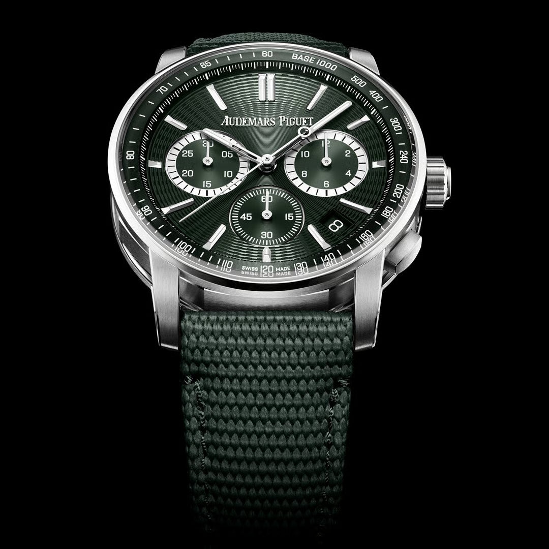 Jualmars Piguet watch with green strap and dark face on a black background