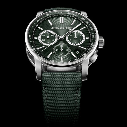 Jualmars Piguet watch with green strap and dark face on a black background