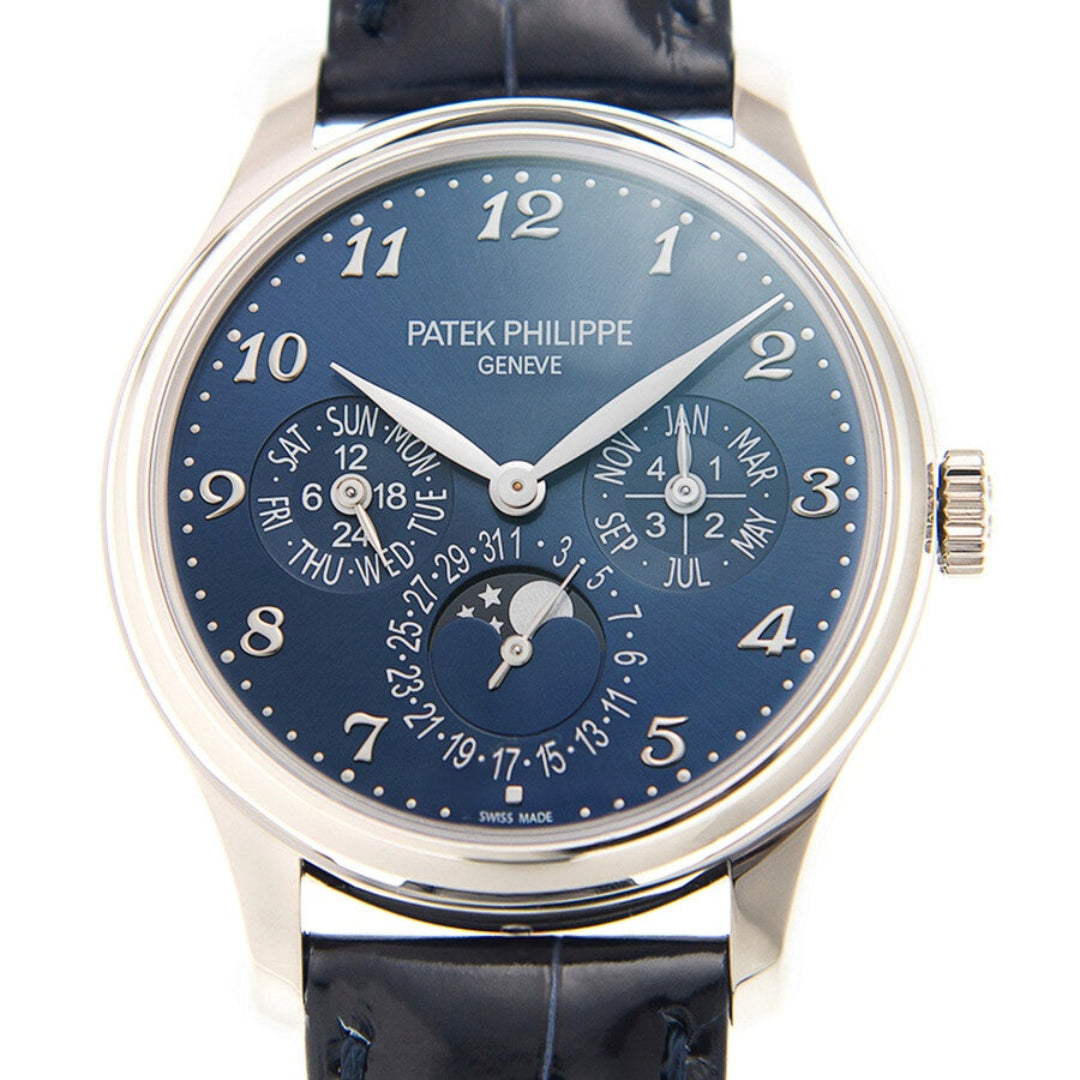 Patek Philippe watch with blue dial and black leather strap on a white background