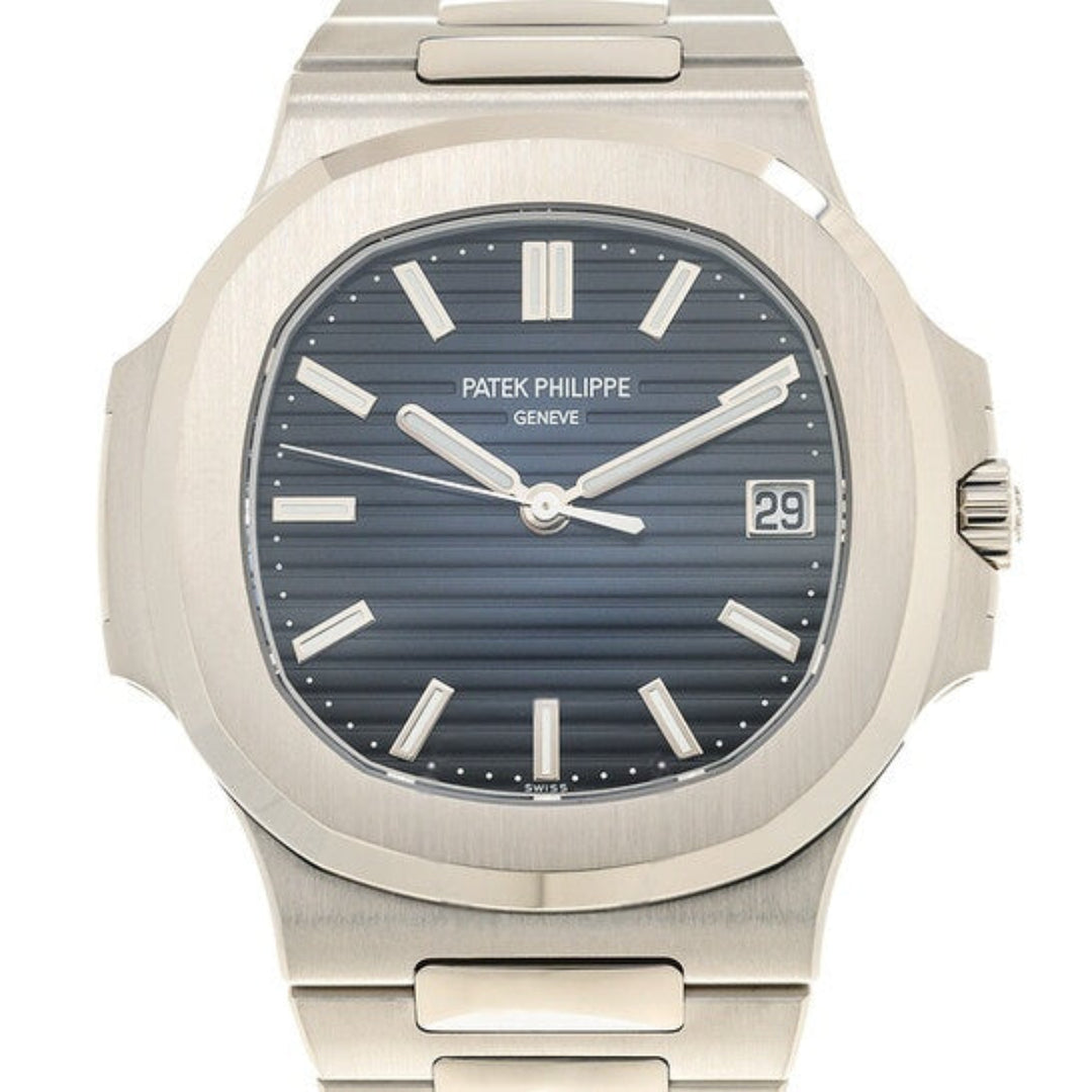 Patek Philippe watch with silver case and blue dial on a white background
