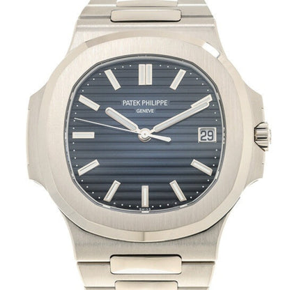 Patek Philippe watch with silver case and blue dial on a white background
